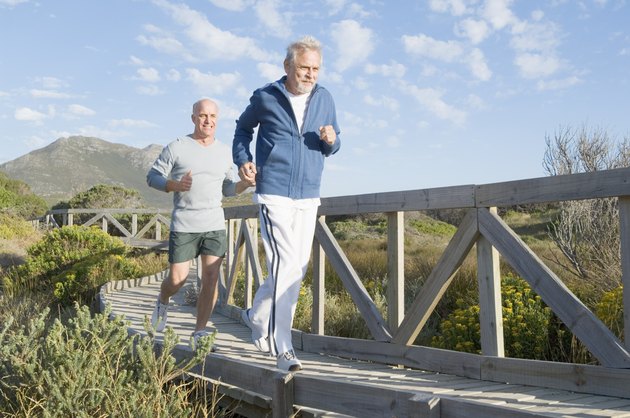 Men jogging on bridge
