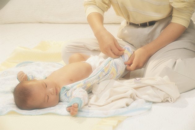 Woman changing baby