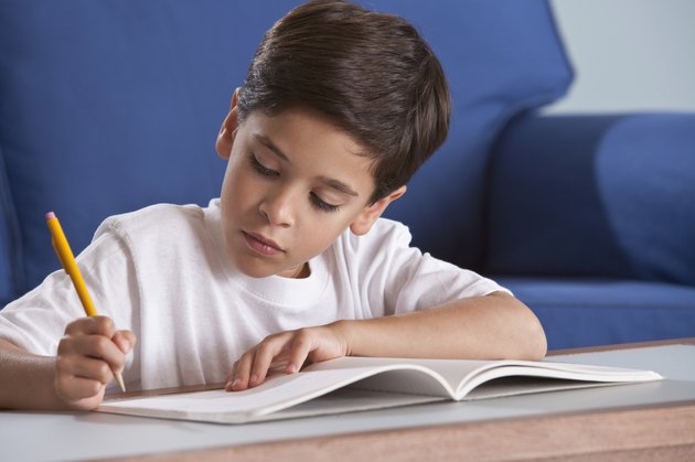 Boy studying in livingroom