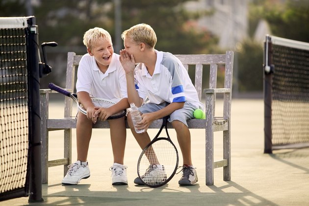 Boys with tennis rackets