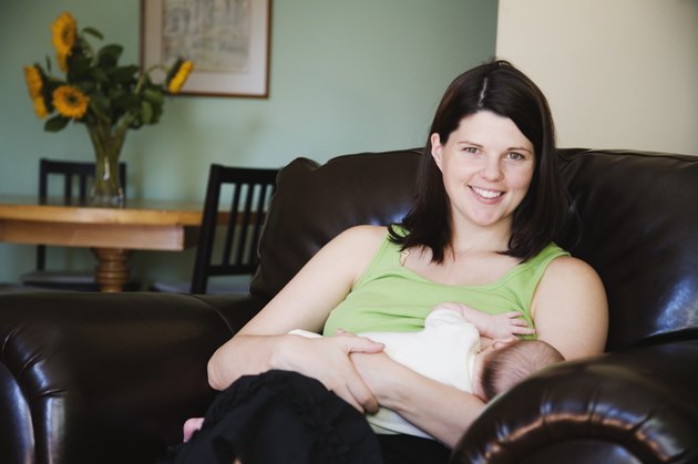 Mother holding newborn baby girl