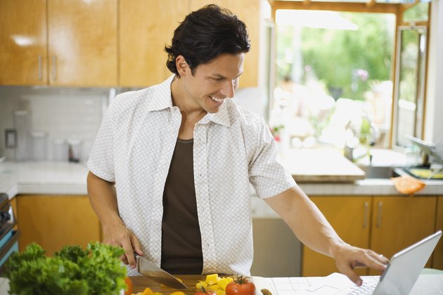 Man chopping bell peppers
