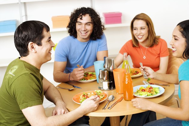 Two young couples eating food