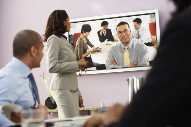 Multi-ethnic businesspeople having video conference