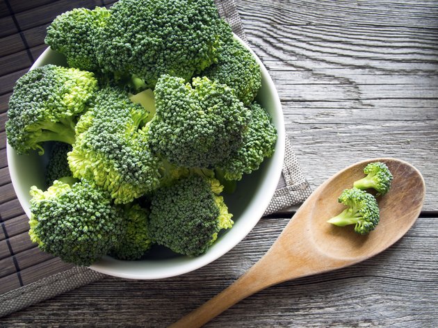 Fresh Broccoli in a bowl on rustic background