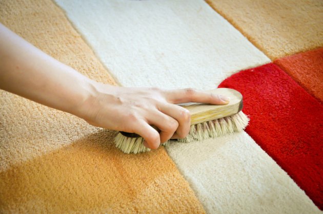 woman cleaning carpet from stain