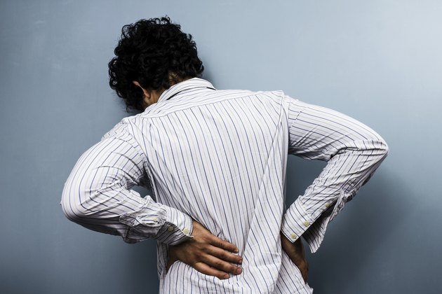 Young man with back pain