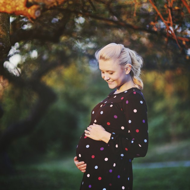 beautiful young pregnant woman laughing