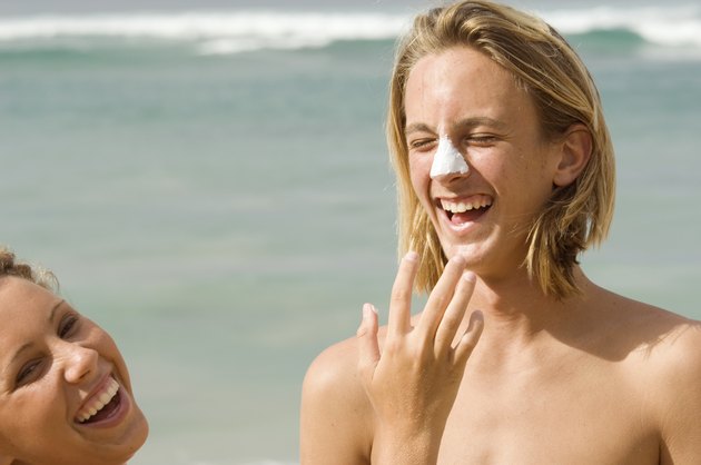 Applying Sunscreen on Hawaiian Beach