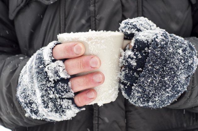 Hands holding a mug