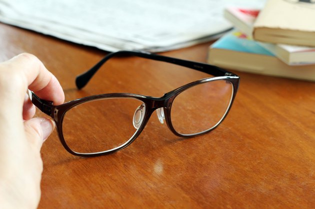 Glasses and books and newspapers