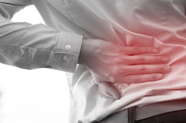Man in office uniform having back pain issue / back injury