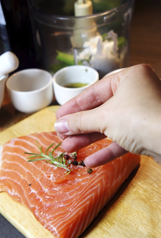 Beautiful filet of salmon on the wooden background