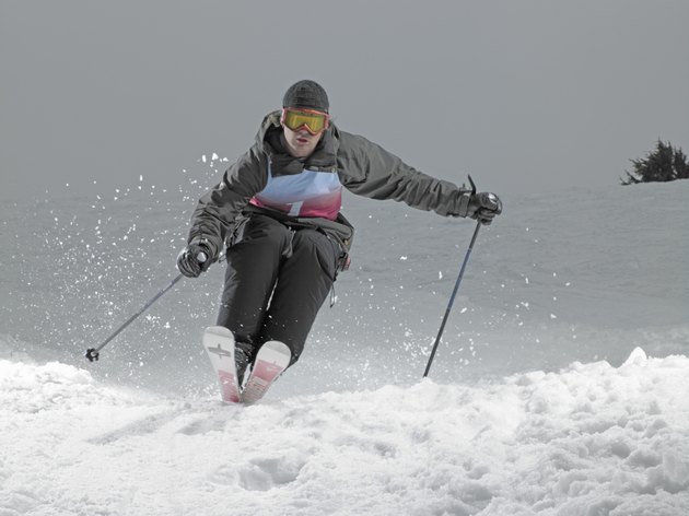 Skier, skiing down slope