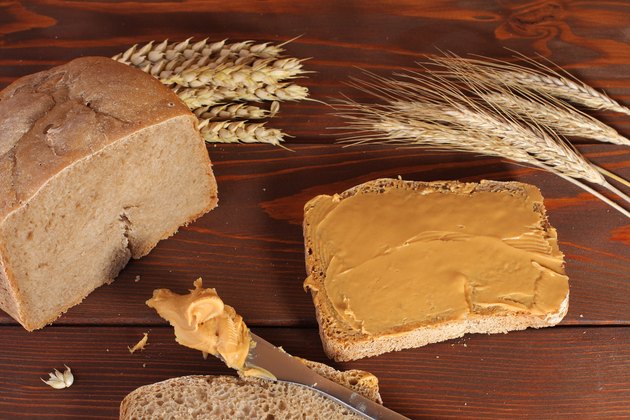 Loaf of wheat,rye bread, sliced bread with peanut cream