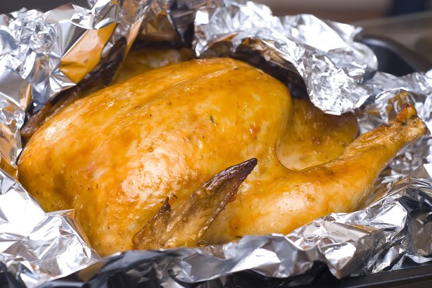 juicy golden chicken in foil