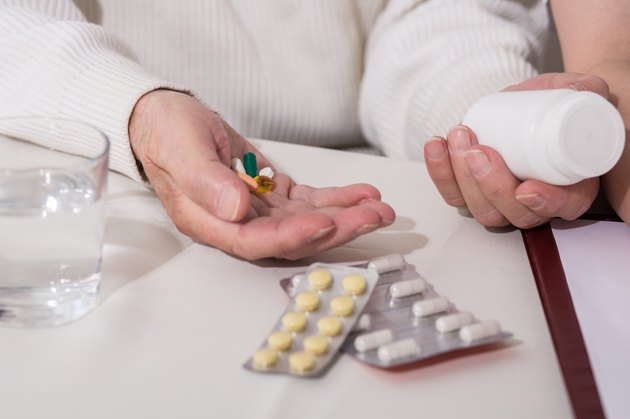 Senior man taking medicament