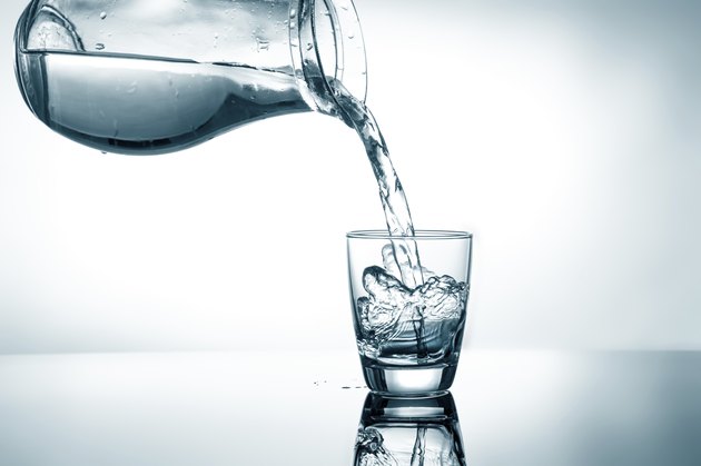 Filling in glass of water