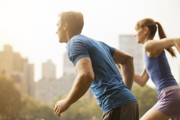 Couple running in urban park