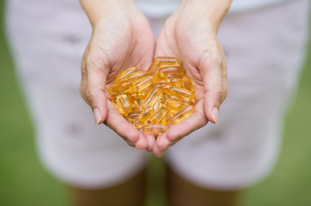 handful of Omega-3 capsules