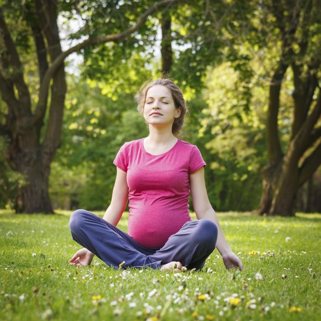 Beautiful pregnant woman in the park
