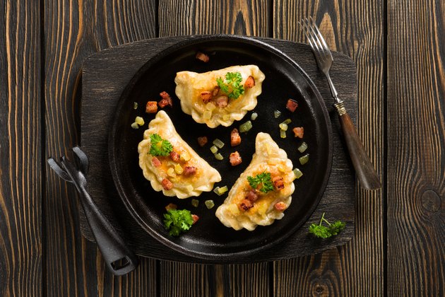 Fried dumplings with onion and bacon top view