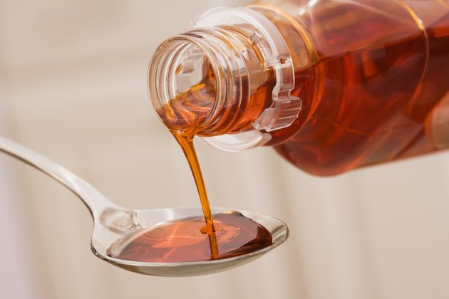 Cough syrup being poured