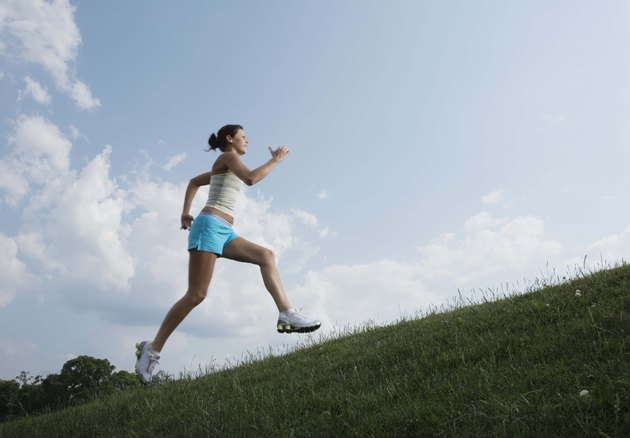 Woman running on hillside