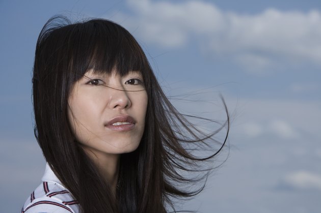 Young woman, smiling, front view, close up