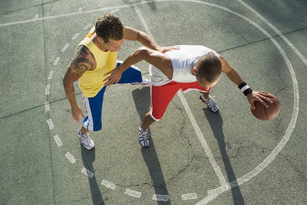 Men playing basketball