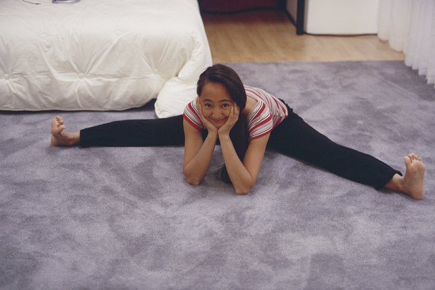 Teenager sitting on the floor