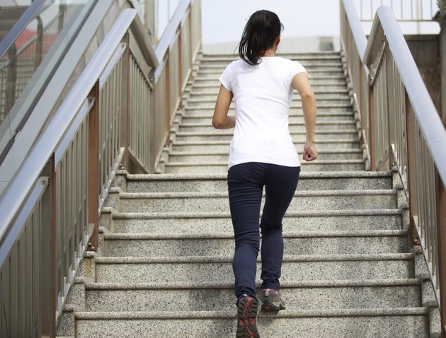 woman running on stone stairs