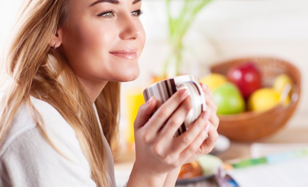 Cute female having coffee