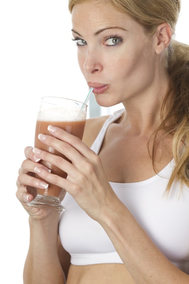 woman sipping fruit drink
