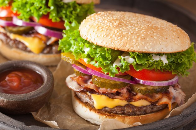 bacon cheese burger with pickles tomato onion