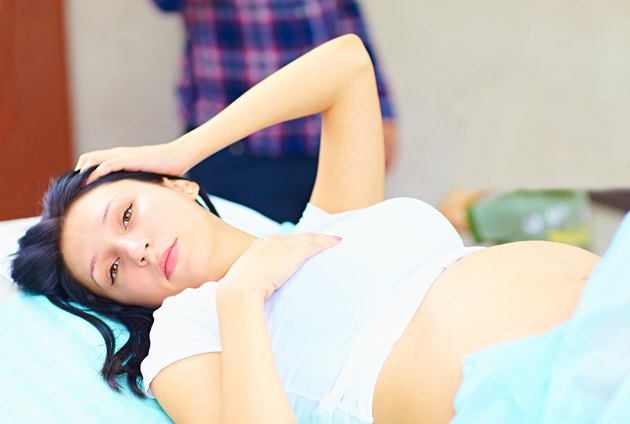 tired young pregnant woman during childbirth