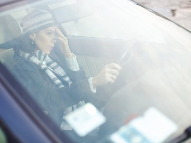 Frustrated Woman Driving a Car