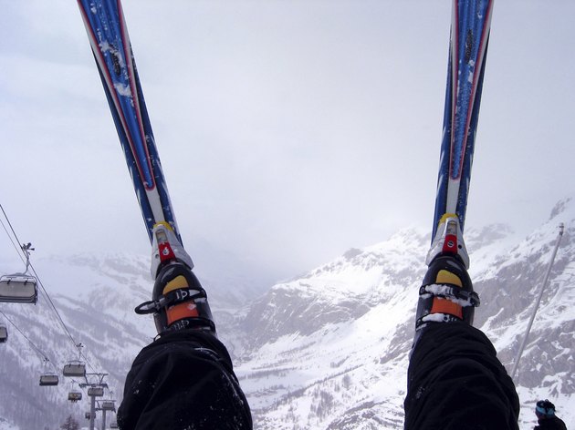 Skis over foggy Alps