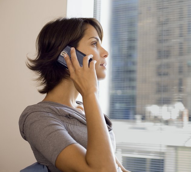 Businesswoman using cell phone