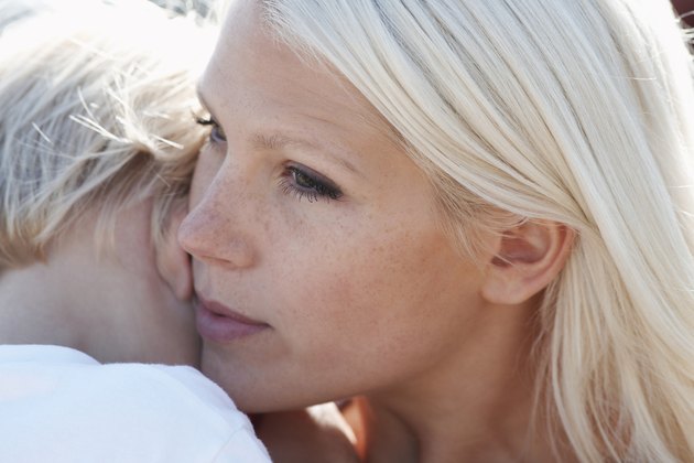 Young mother and son (3-4) close-up focus on mother's face