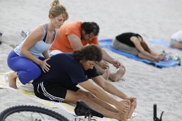 Floridians Relieve Stress With Yoga On The Beach
