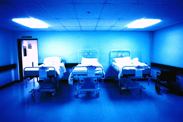 interior of a hospital recovery room with three beds