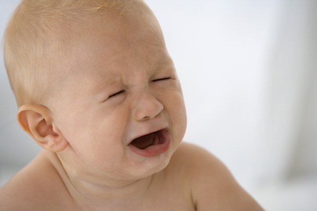 How to Calm a Baby's Tummy Ache | Livestrong.com