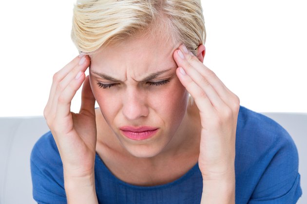 Attractive woman having headache