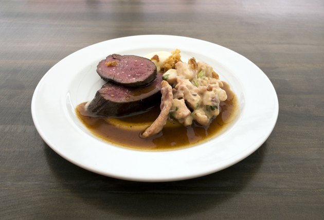 Grilled saddle of deer, grilled octopus, dressing of orange and pink ginger
