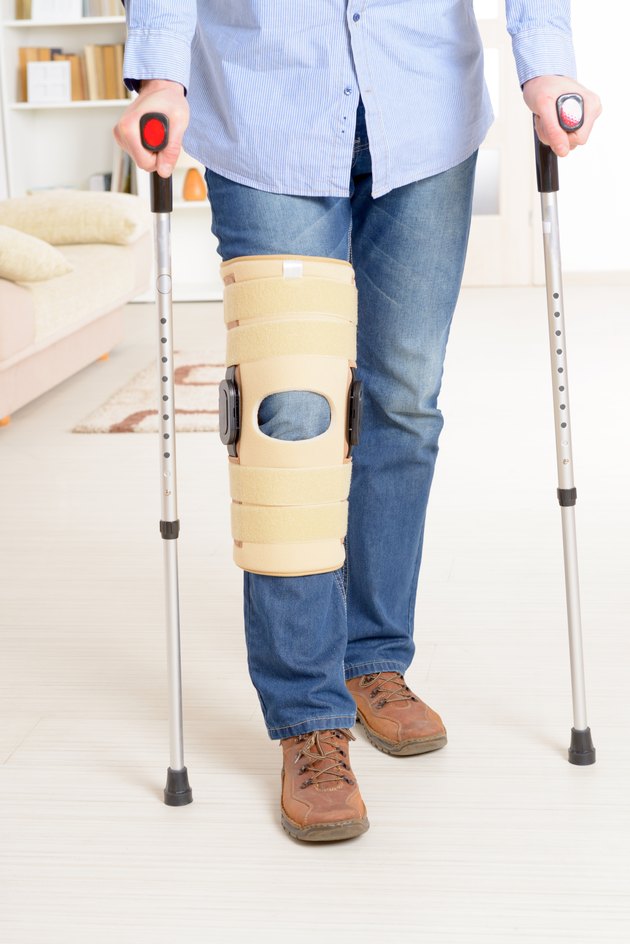 Man with leg in knee cages