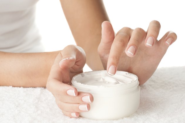 Woman applying cream
