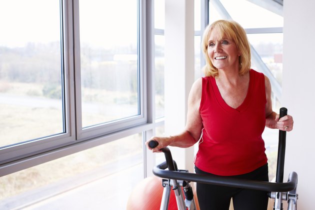Mature Woman Using an Elliptical Machine