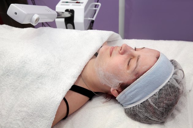 Beauty treatment of young female face, ozone facial steamer