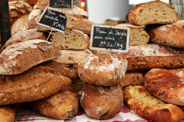 Fresh loaves of french bread on market stall in Provence
